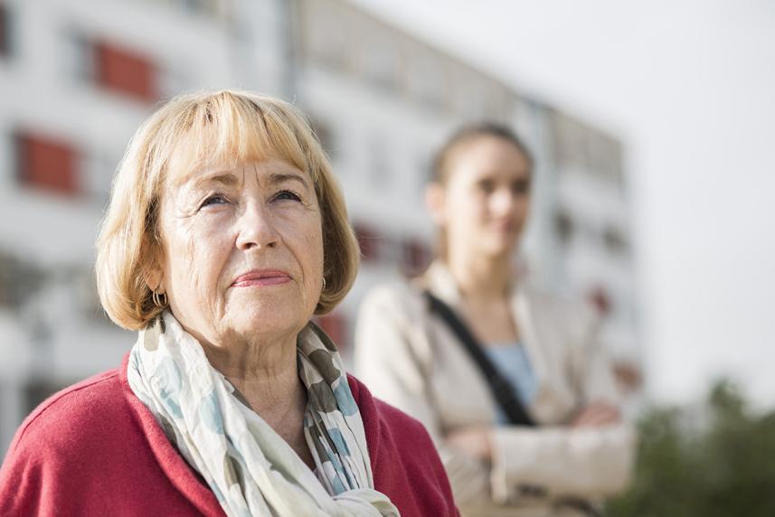 Image of older woman with younger woman blurred in background